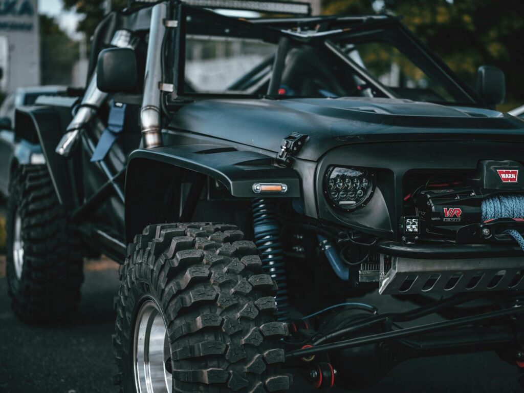 Detailed view of a rugged off-road vehicle with black livery ready for adventure.